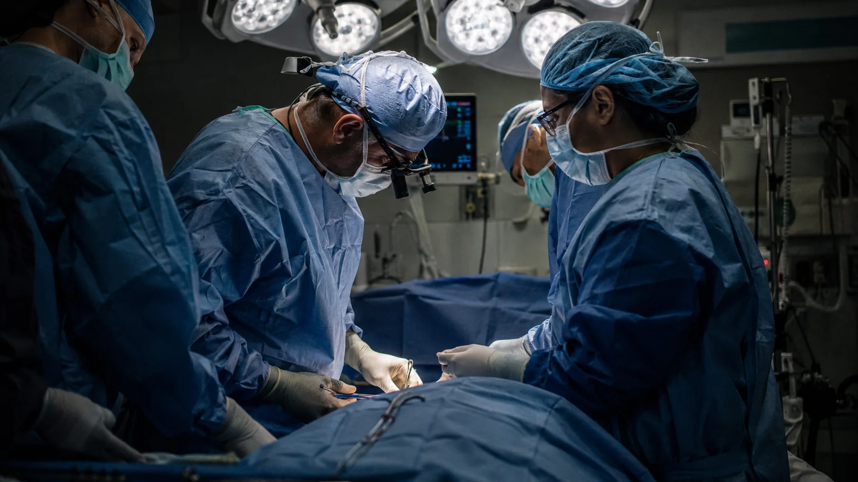 General surgery team performing a procedure in an operating room