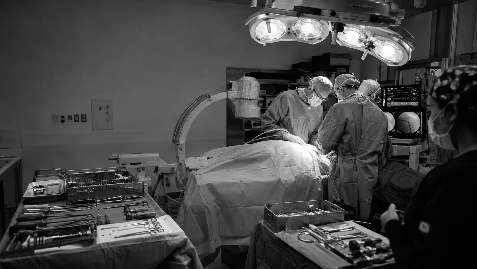 Orthopedic surgical team performing a procedure in an operating room